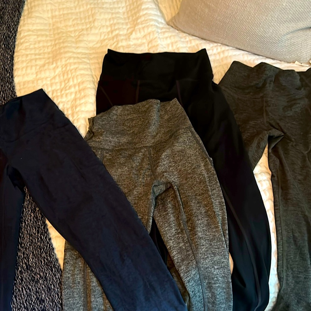 Four pairs of leggings- mixed brands 3 small and one medium